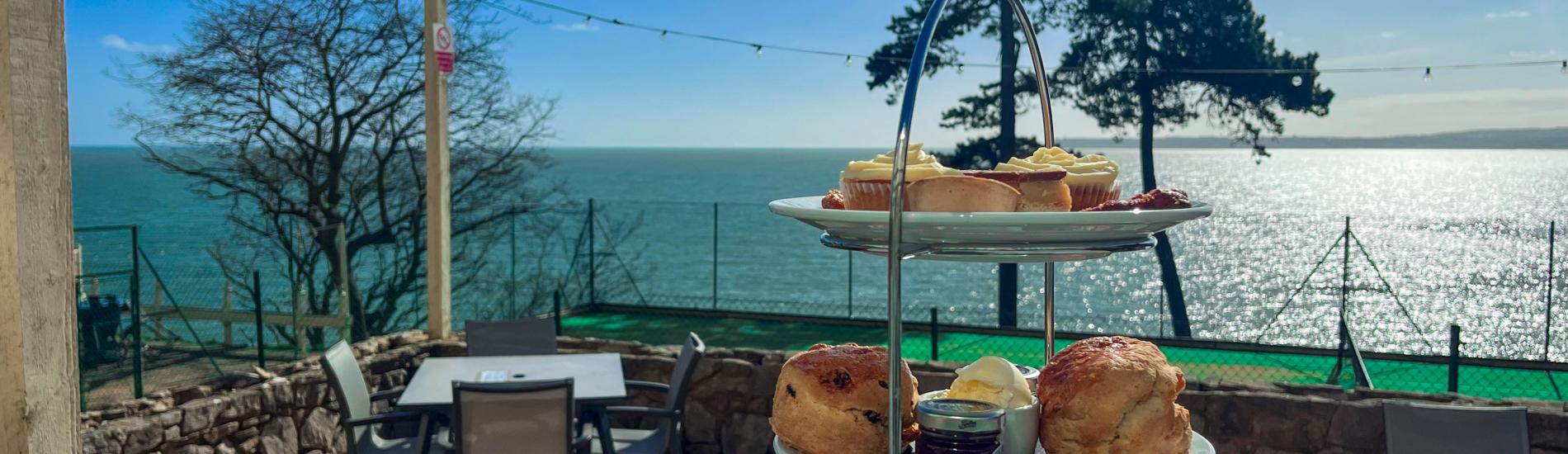 View of Afternoon Tea served on the outdoor terrace on a bright sunny day
