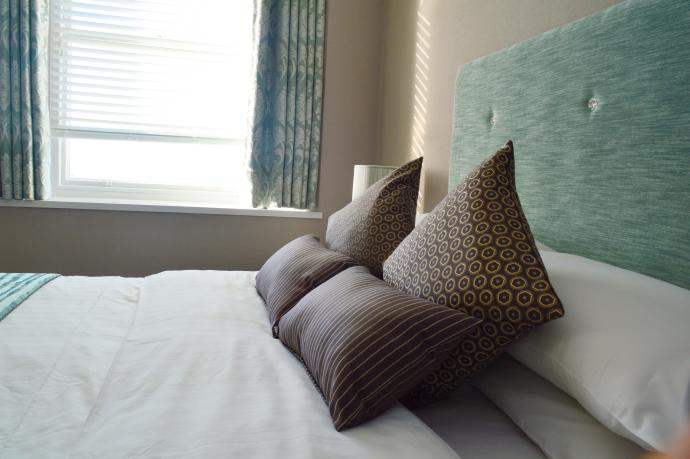 Standard Double bed with sea view window at the Osborne Hotel, Torquay